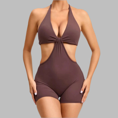 Brown fitness two-piece made from organic cotton. Features a relaxed fit with breathable material for comfort.