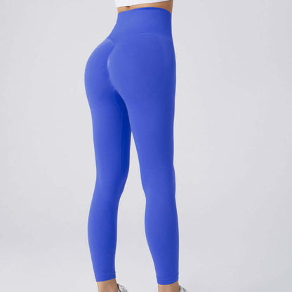 Woman wearing blue workout running leggings, size options S, M, L, ideal for activities. Model showing back view in comfortable fit.