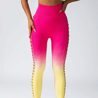 Gradient booty leggings in pink to yellow fade with side lace details, featuring a high waistband for a stylish look.