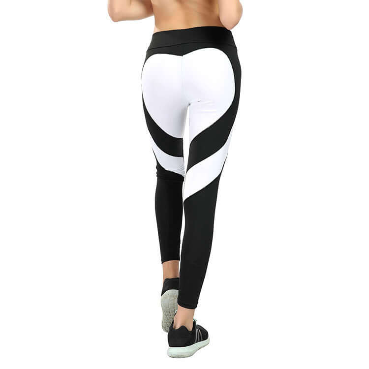 Heart Stitch Yoga pants with black and white heart design on the back, highlighting fitness fashion.