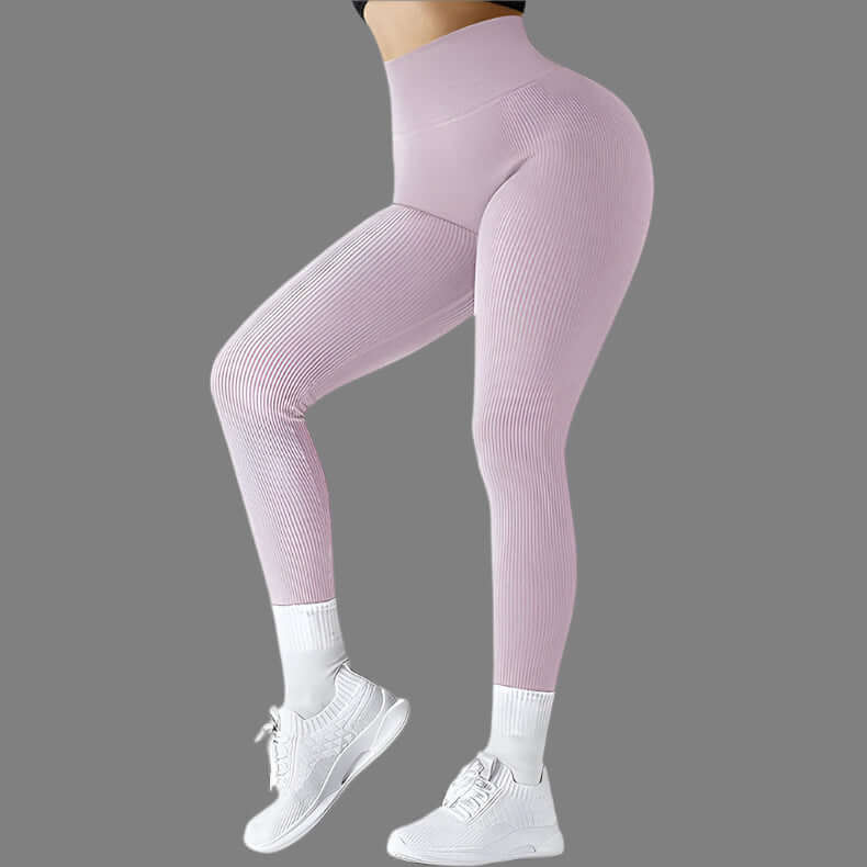 Seamless fitness leggings in pink, showcasing snug fit and flexibility, perfect for workouts. Highlighting full length and stretchy fabric.