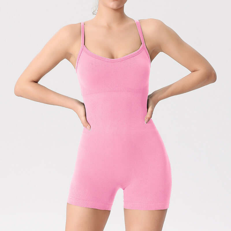 Sporty yoga bodysuit in pink. Made from organic cotton. Features a relaxed fit and breathable material. Perfect for comfortable workouts.