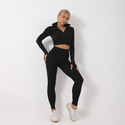 Woman wearing a black seamless leggings set with a crop top and jacket, showcasing activewear fashion.