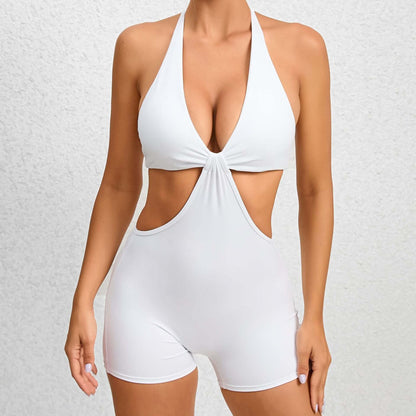 Two-piece fitness outfit in white, featuring organic cotton and relaxed fit. Designed for breathable comfort and style.