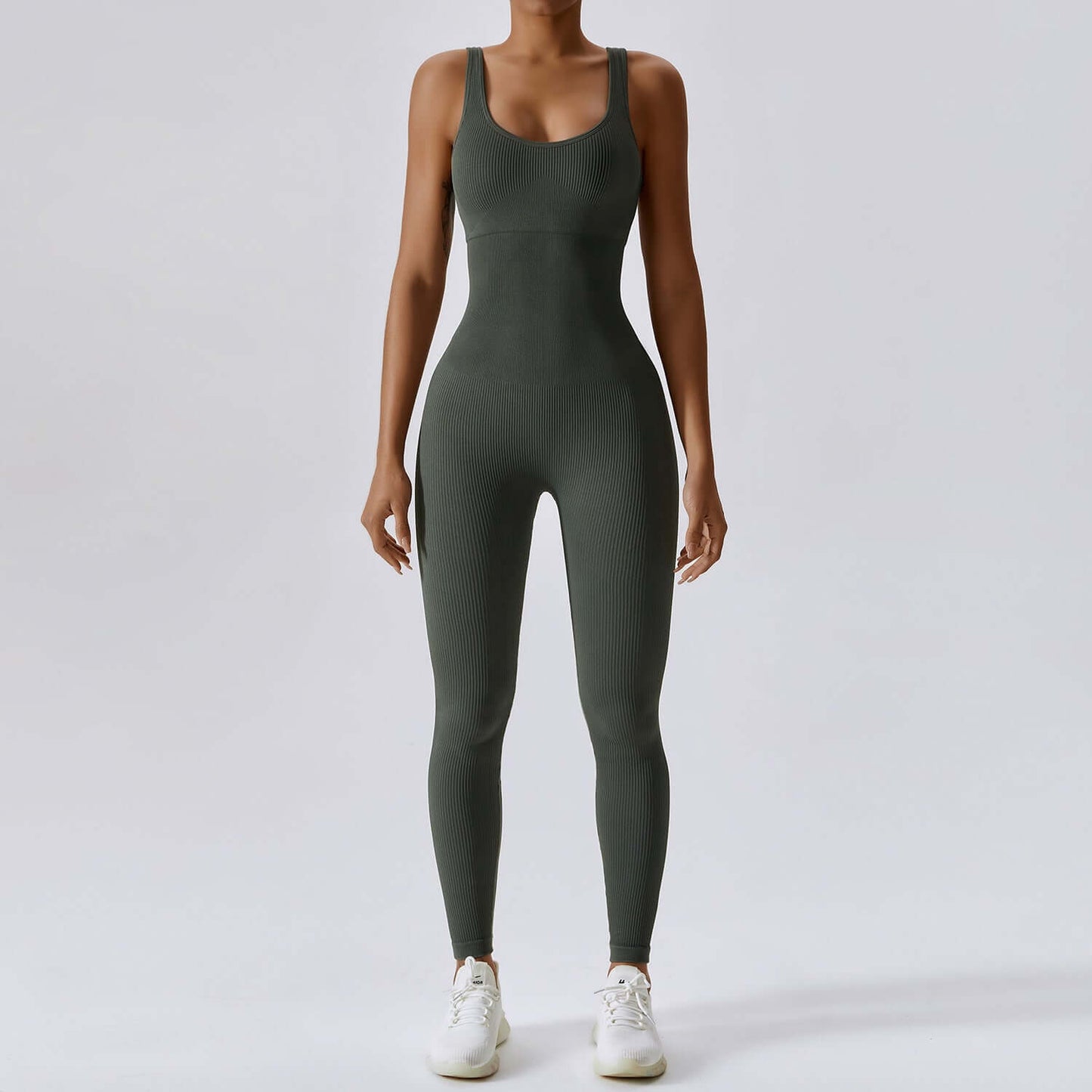 Olive green sculpting yoga bodysuit showcasing tight fit, seamless design, sleeveless open-back style, and moisture-wicking fabric.