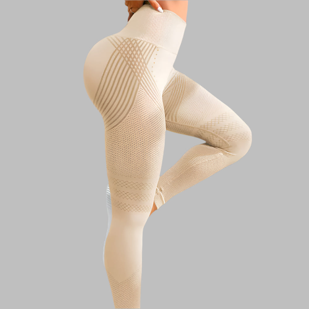 High waist beige sport leggings for women with hip lifting design and stretch material on a gray background.