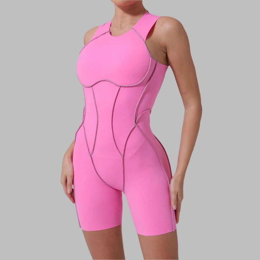 Breathable and seamless pink yoga jumpsuit made from organic cotton, offering a flexible and relaxed fit for lightweight yoga practice.