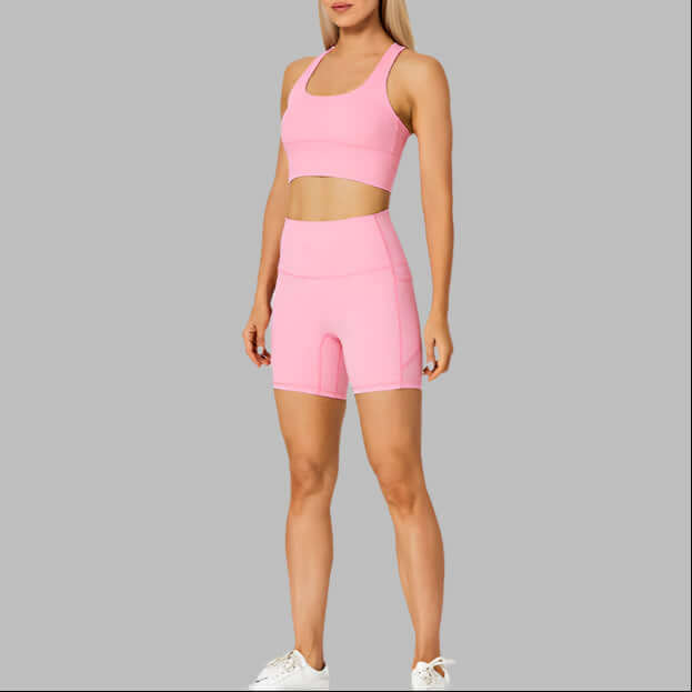 Women's pink outdoor sport set with crop top and shorts, perfect for exercise and fitness