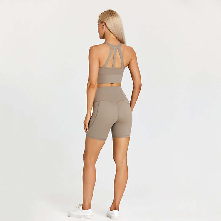 Woman wearing beige athletic outfit for outdoor sports