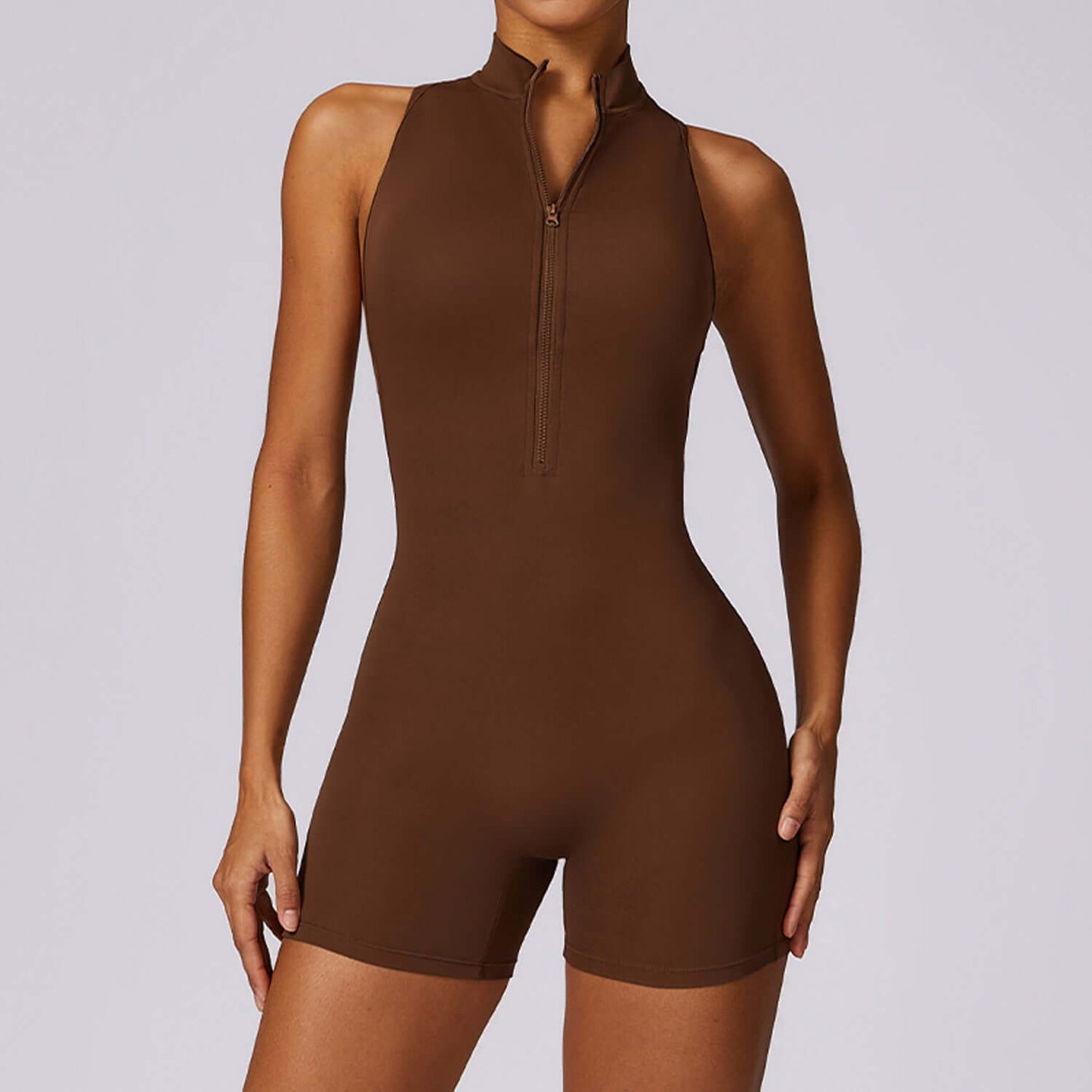 Back Support Yoga Jumpsuit in brown, made of organic cotton. Features a relaxed fit and breathable material for comfort.