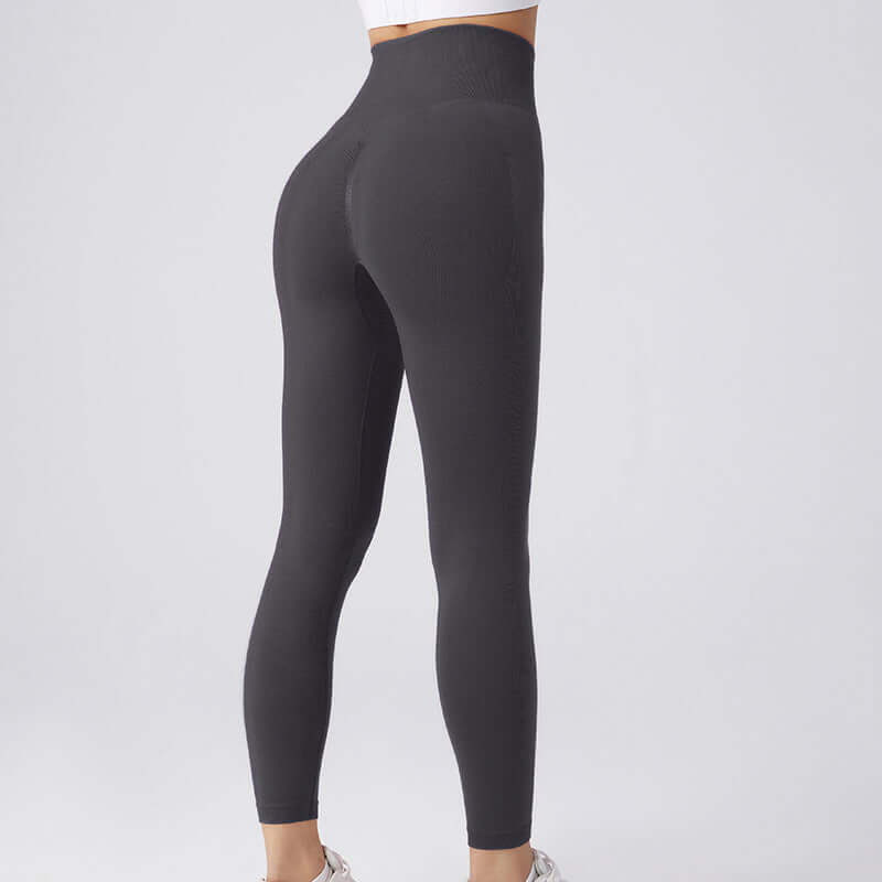 Back view of black workout running leggings for women in size options S, M, and L, showcasing high-waisted fit and lightweight design.