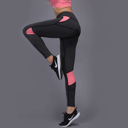 Athletic mesh panel leggings in black with pink accents, perfect for workouts, made from polyester fiber for comfort and flexibility.
