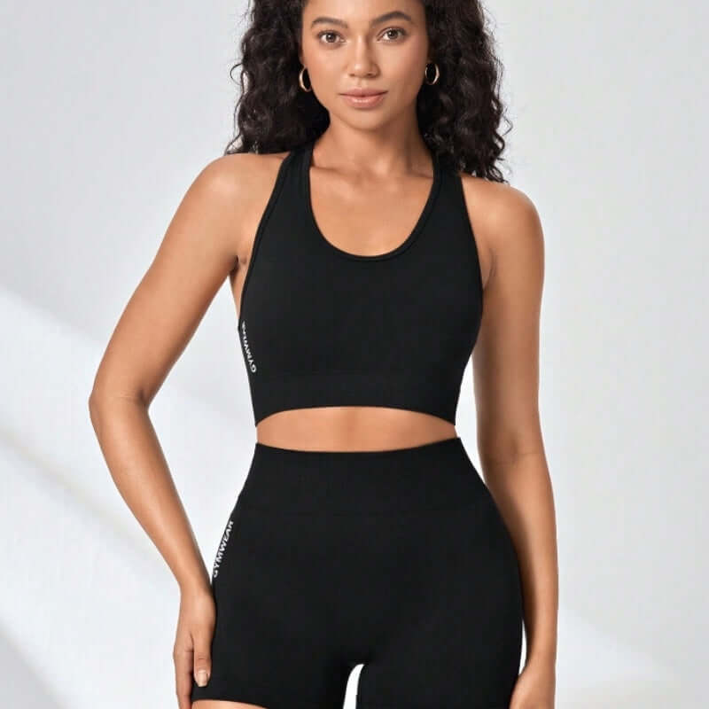 Women's seamless activewear workout set with top and shorts, featuring stretchy fabric for a comfortable fit, ideal for yoga and gym.