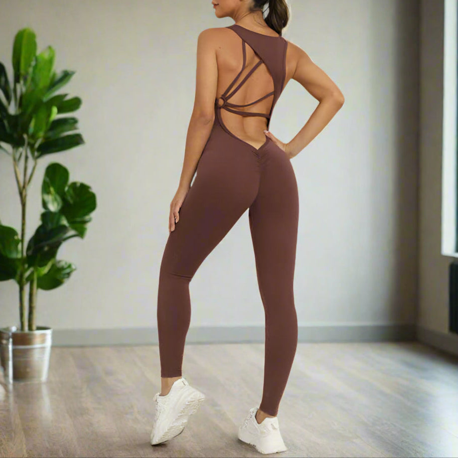 Woman wearing a brown Flex Fit Jumpsuit, showcasing its sleek and supportive design with breathable stretch fabric, ideal for workouts.