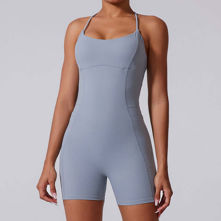 Sporty yoga bodysuit in gray. Made from organic cotton. Features relaxed fit and breathable material.