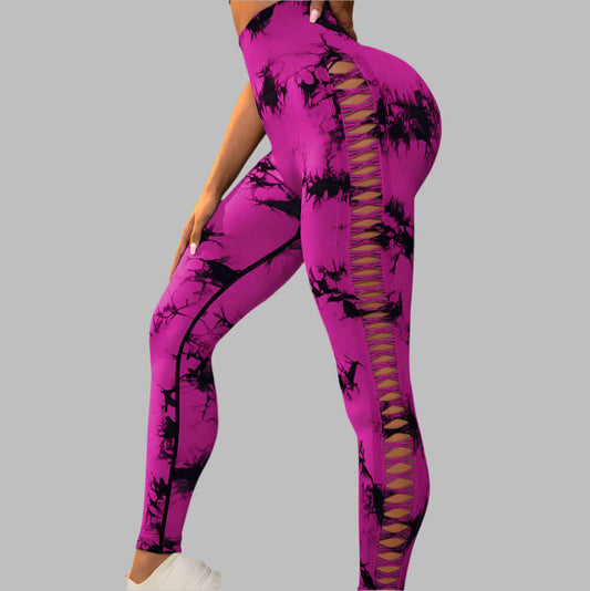 Fashionable purple butt-lift gym leggings with lace-up side design, floral print, and flattering fit for workouts and casual wear.