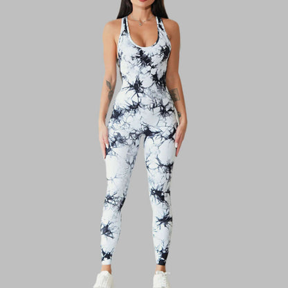 Woman wearing a stylish compression workout bodysuit with abstract pattern, perfect for yoga and fitness, against a gray background.