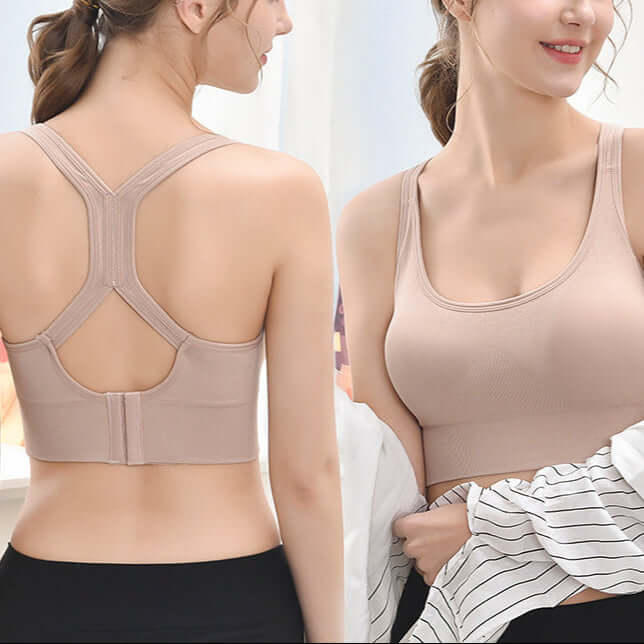 Beige crossback sports bra with wireless design, open-back, adjustable straps, and full coverage. Ideal for yoga or gym sessions.