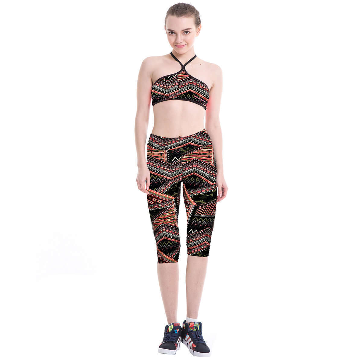 Woman wearing printed yoga leggings and matching top, showcasing stylish activewear. Ideal for yoga and fitness enthusiasts.