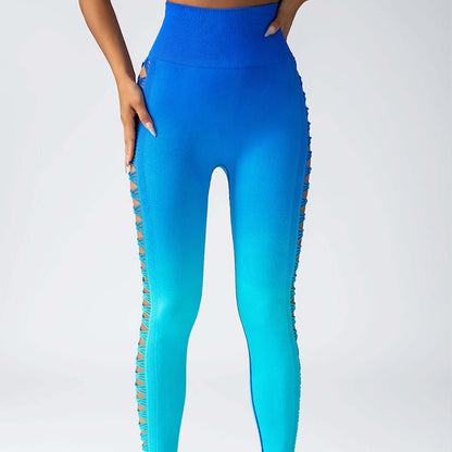 Gradient booty leggings with blue ombre design and side cutouts, showcasing high-waisted fit and stylish pattern for fashion and fitness.