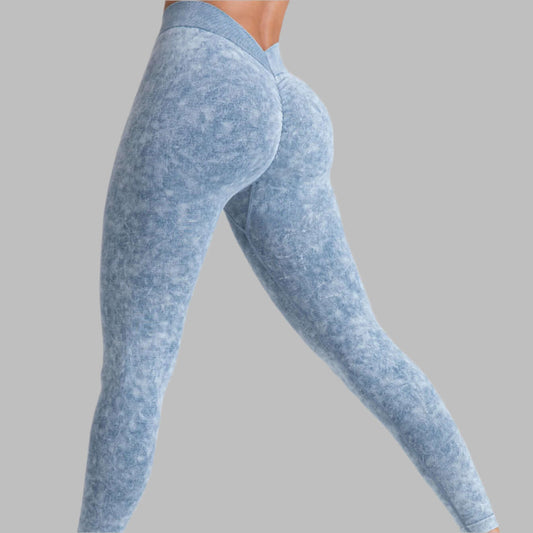 Blue high-waist gym leggings showcasing sleek design against grey background