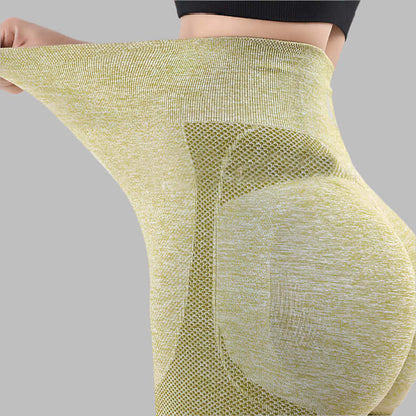 Stretchable green seamless gym leggings showcasing flexibility and comfort for workouts.