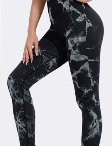 Black and white tie dye leggings with abstract pattern, showcasing stylish and comfortable fit for active or casual wear.