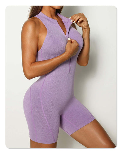 Woman wearing a zip-up sleeveless romper in lavender. Made from organic cotton. Relaxed fit. Breathable material for comfort.