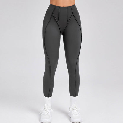 Women's compression gym leggings in dark grey, offering a sleek and supportive fit for enhanced athletic performance.