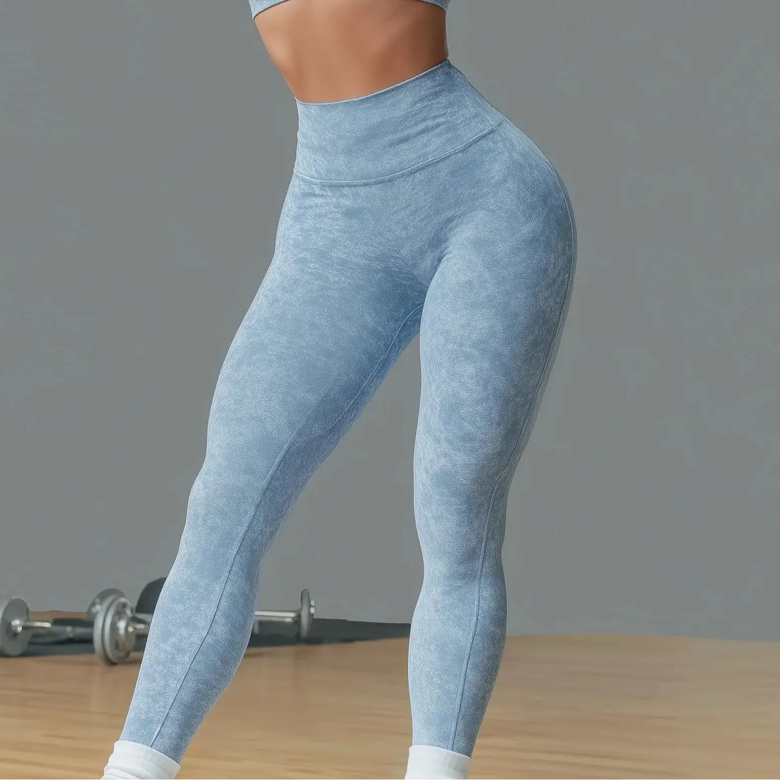 High-waist blue gym leggings sculpting silhouette, lifting and contouring fit, seamless Lycra for yoga or training, sizes S-L