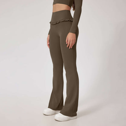 Woman wearing olive high waist leggings with flared legs and ruffle detail