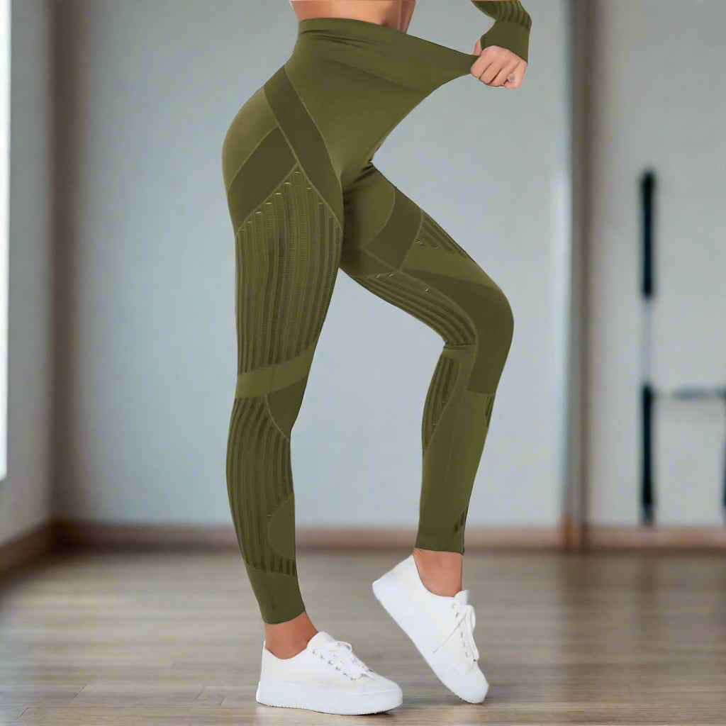 Olive green hip-lifting sports leggings with ribbed texture, shown on model highlighting stretch and fit, paired with white sneakers.