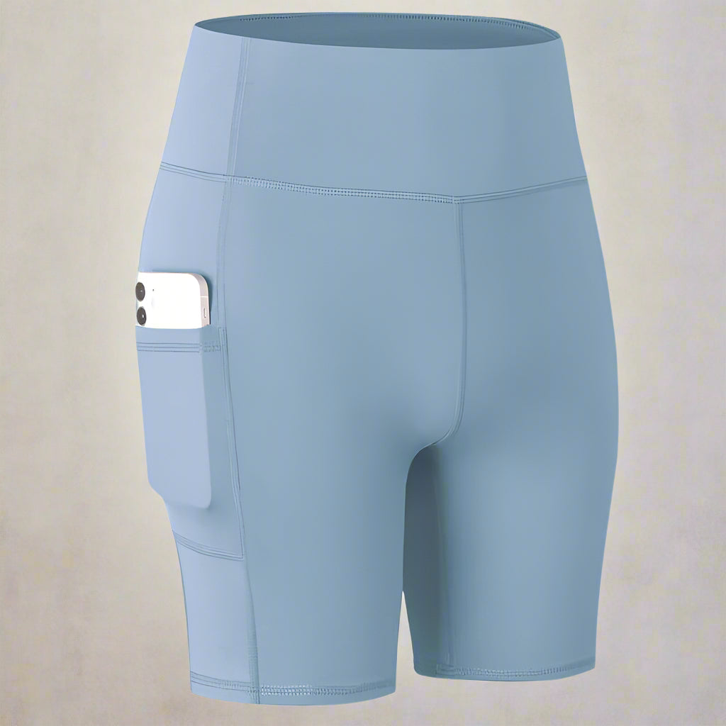 Light blue pocket sport shorts with high waistband and phone pocket, designed for comfort and convenience during workouts.