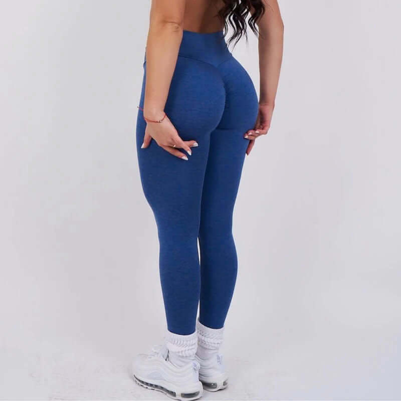 Back view of person wearing blue Sculpt Fit Scrunch Leggings, highlighting figure-enhancing design and comfortable fit.