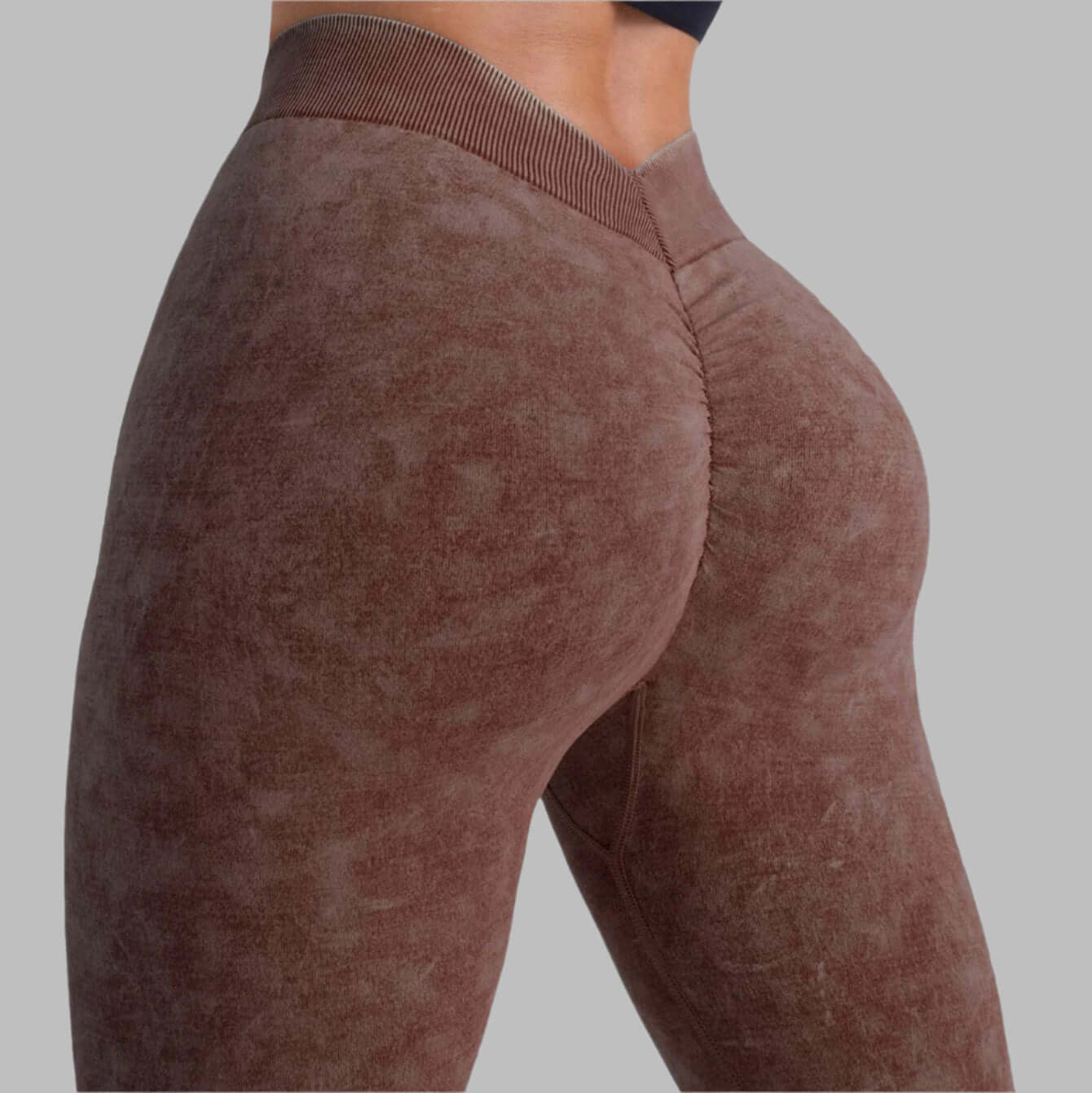 Side view of high-waist gym leggings in brown, showcasing fit and texture, ideal for workout and athleisure wear.