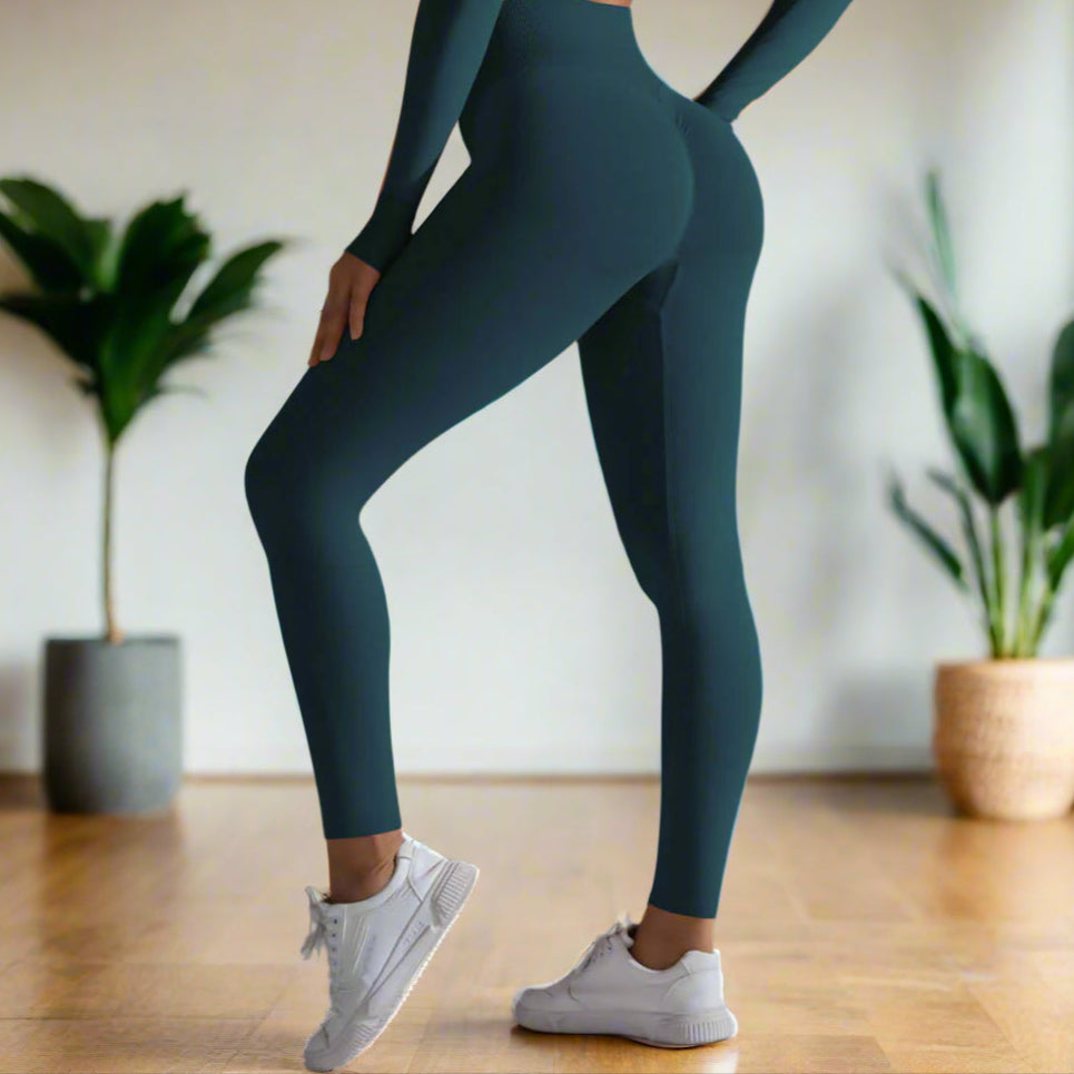 Seamless high waist leggings in teal, featuring a snug fit for comfort and style, paired with white sneakers.