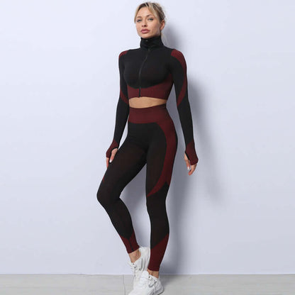 Woman in seamless leggings, crop top, and bra set in black and burgundy tones, standing against a plain background.