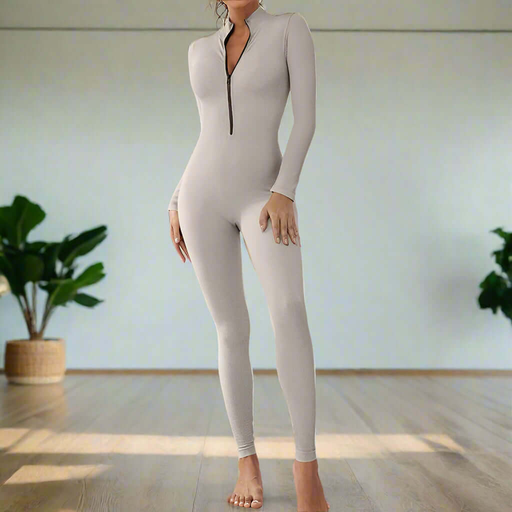Woman wearing seamless zipper yoga bodysuit with long sleeves and slim fit, perfect for fitness and daily wear.