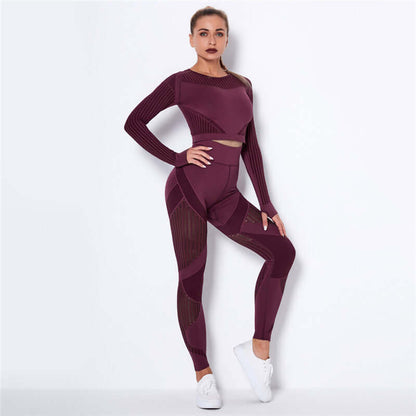 Woman wearing a burgundy striped fitness set, featuring a long-sleeve top and leggings, perfect for workouts or casual wear.
