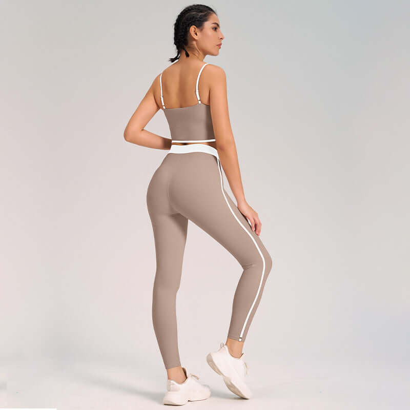 Back view of woman wearing a taupe Ultra-Soft Yoga Outfit 2-Piece Set with white stripes, perfect for comfort and flexibility.
