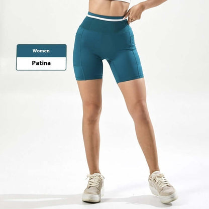 Women's compression shorts in teal color, designed for fitness and comfort, with high waistband for support.