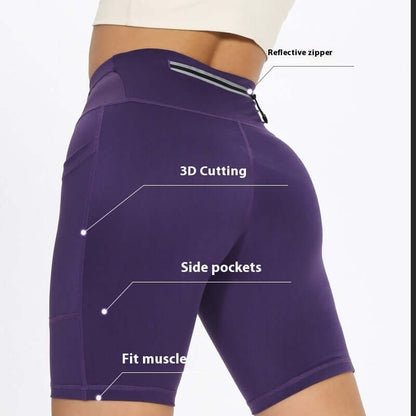 Women's compression shorts with reflective zipper, 3D cutting, side pockets, and muscle fit design in purple.