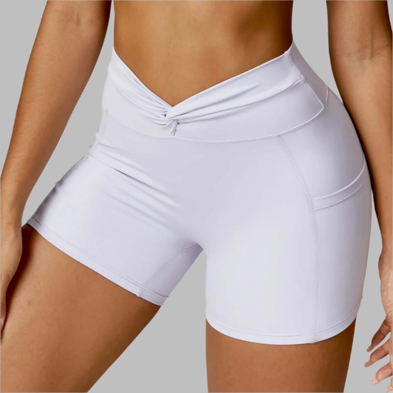 Close-up of women's white outdoor running shorts with a high waistband, showcasing breathable and comfortable fabric.