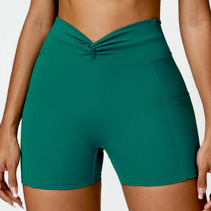 High-waisted green outdoor running shorts with side pockets for women