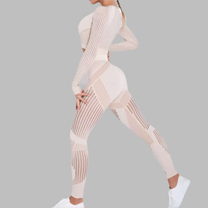 Woman wearing a beige striped fitness set with long sleeves and matching leggings, showcasing stylish and functional workout wear.
